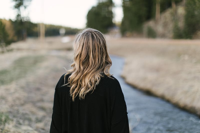 Woman walking in a forest